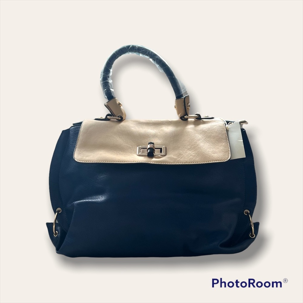 Medium size shoulder bag. It’s a navy blue & cream combination